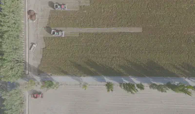 Aerial view of coordinated machinery operations at the chili production base